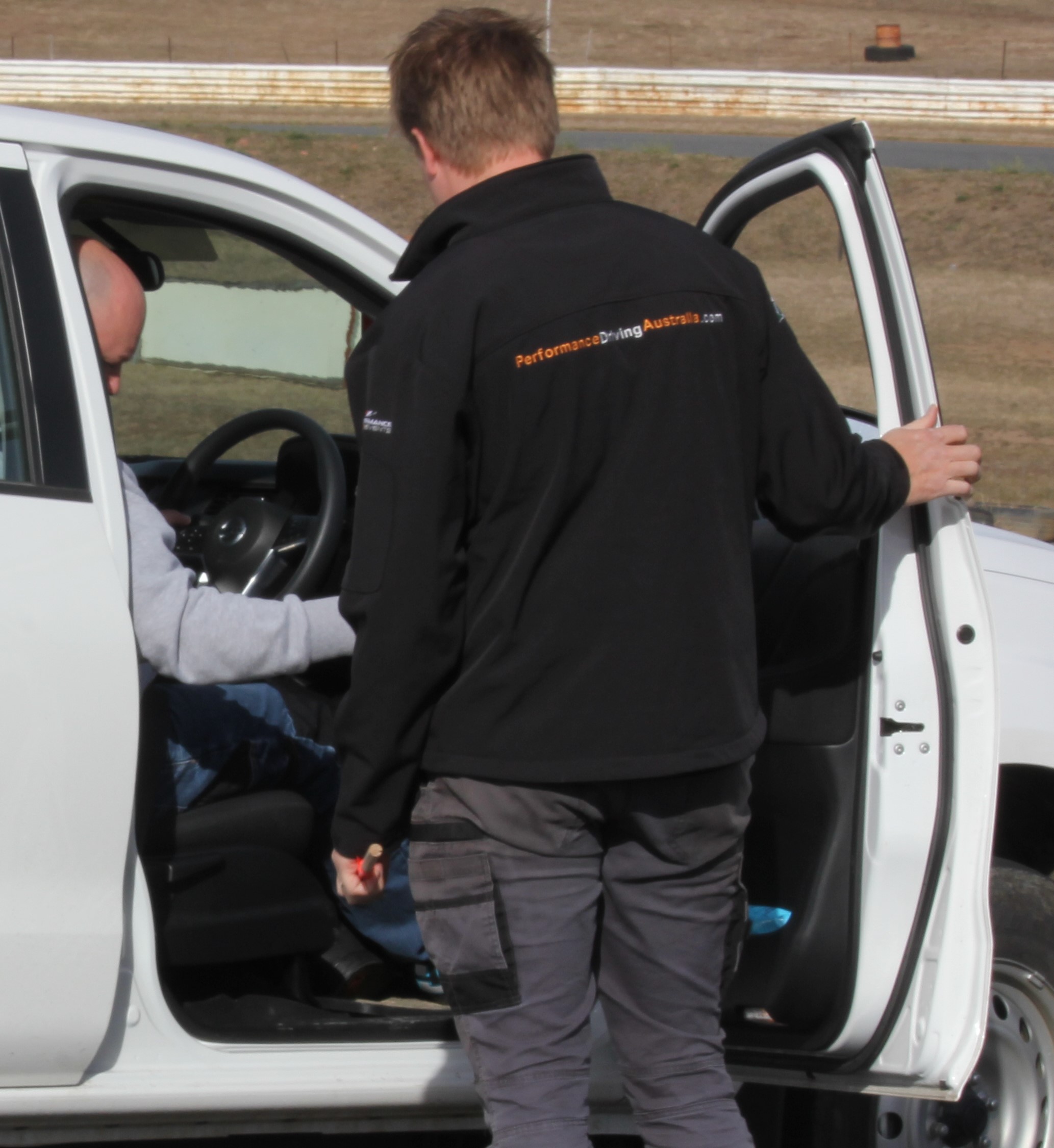 One of the members of PDA Team engaging with a person inside the car